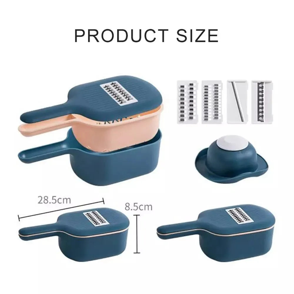 Dark blue vegetable cutter with four stainless steel blades, a hand guard, and a drain basket on a kitchen counter.