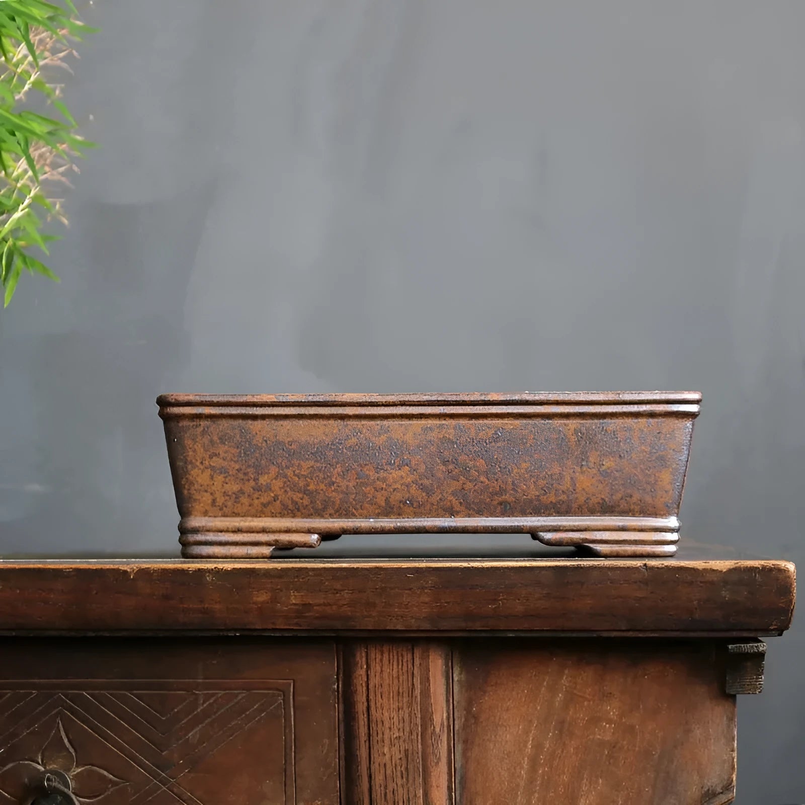 Rectangular unglazed purple sand bonsai pot showing simple design and base with five drainage lines.