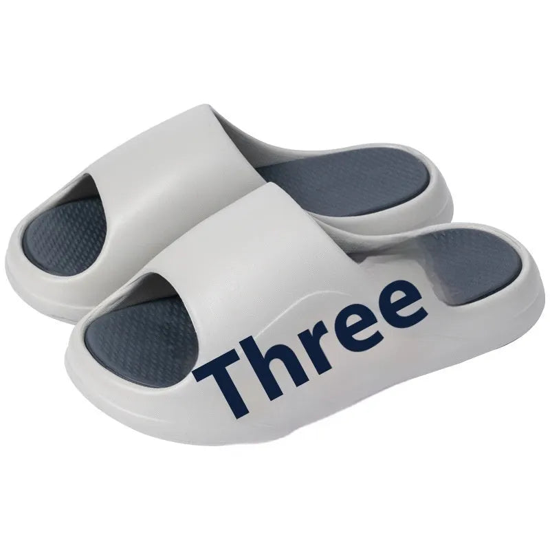 EVA platform slippers in brown, black, red and black, or white and black colours with letter design elements