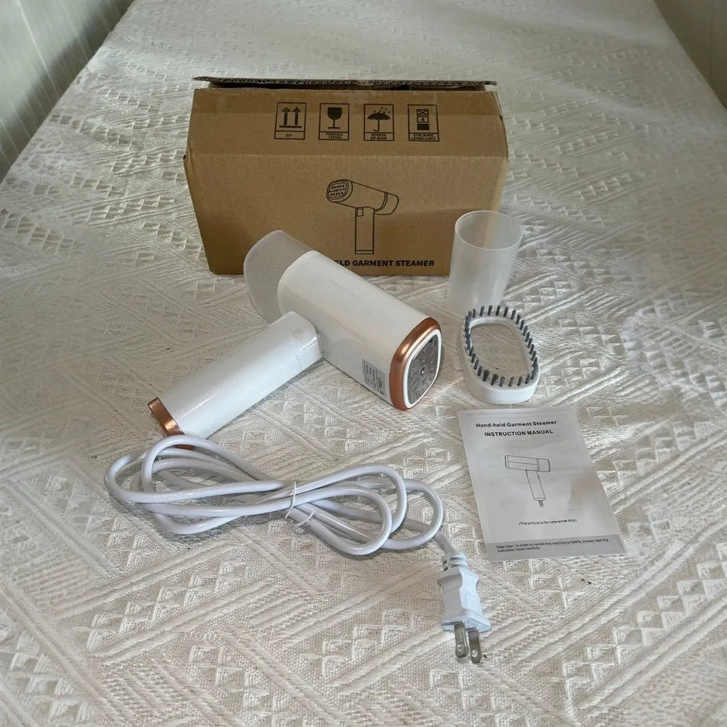 Portable handheld garment steamer in white foldable design with non-stick liner and UK plug