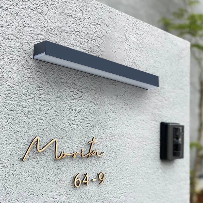 Solar-powered outdoor wall lamp with black ABS plastic shell and IP65 waterproof rating for garden lighting