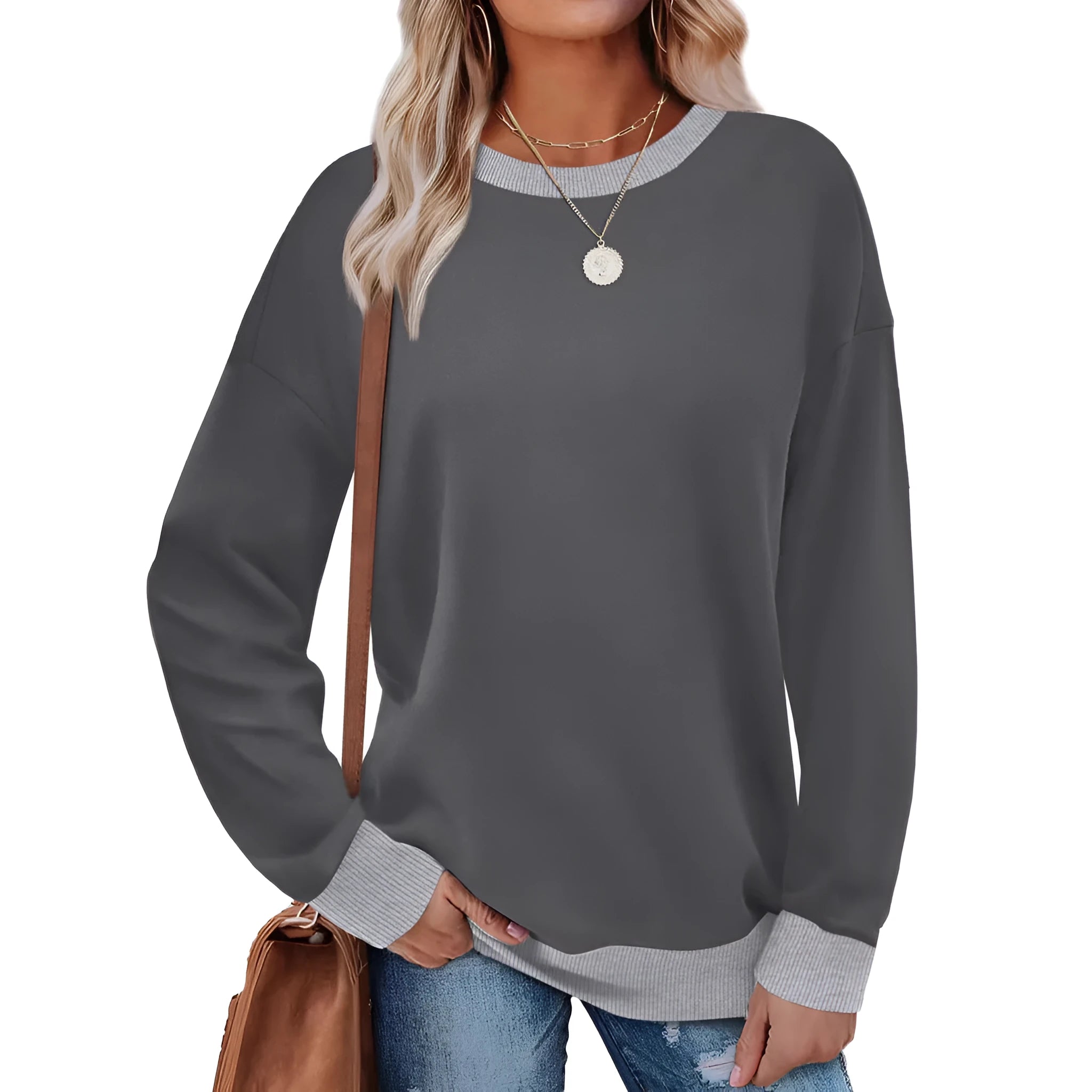 Woman wearing a loose-fitting striped long sleeve top with a round neckline in a grey colour.