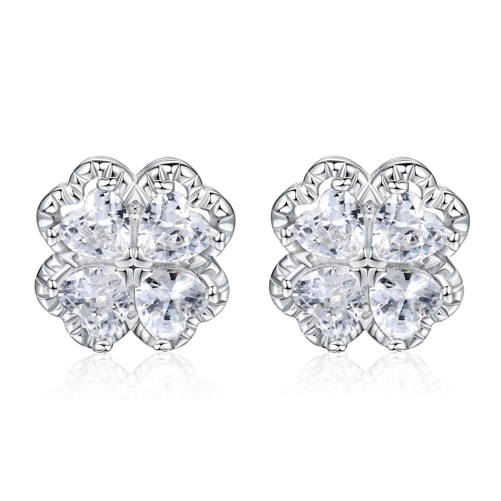 Close-up of women's heart-shaped zircon earrings in 925 silver with a white gold colour finish.