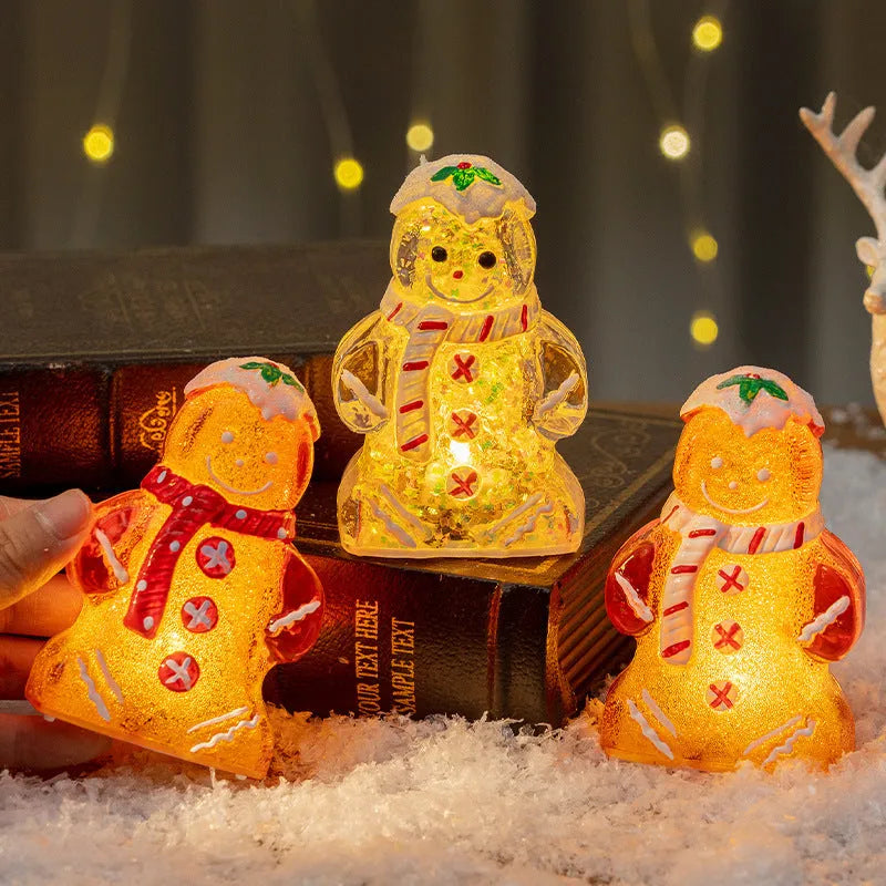 Glowing LED Christmas ornament of a gingerbread man with a red scarf.