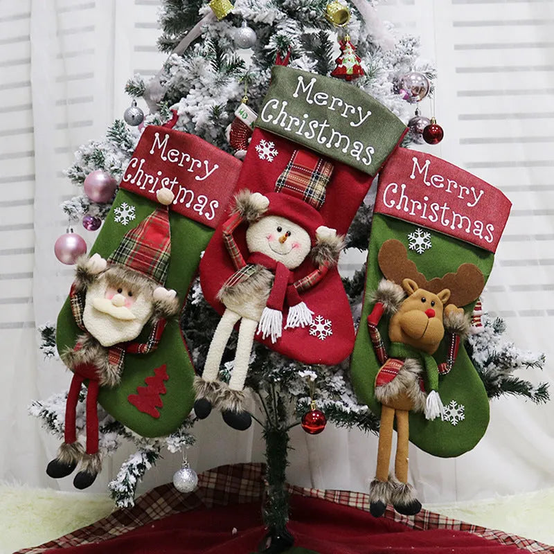 Set of three large red, white, and brown Christmas stockings featuring 3D Santa, Snowman, and Reindeer designs with hanging loops