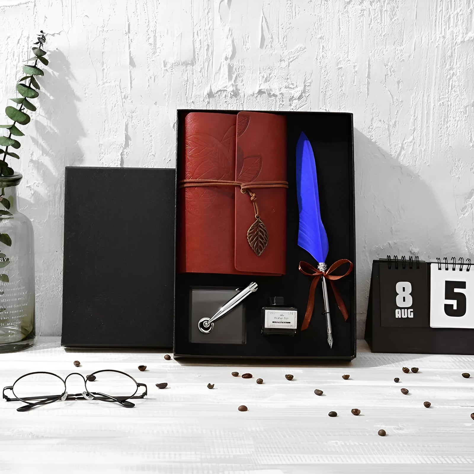 Feather dip pen gift set with copper pen, ink bottle, acrylic base, and antique book in box
