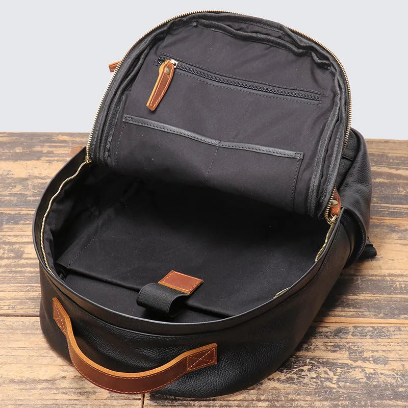 Black genuine leather top grain cowhide expandable travel backpack with curved shoulder strap