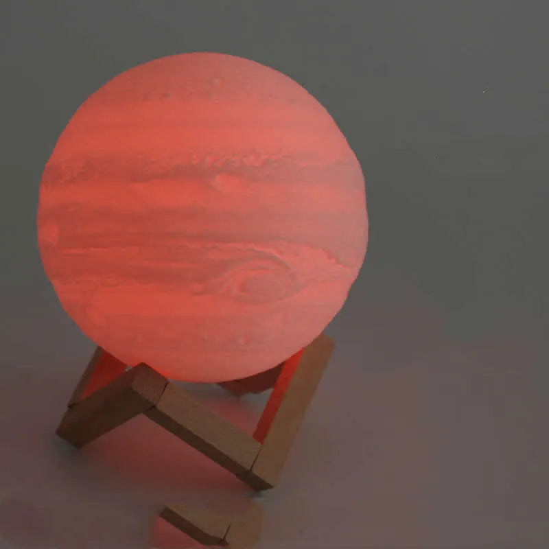 3D printed moon lamp on wooden stand showing detailed lunar surface, with touch ring at base.