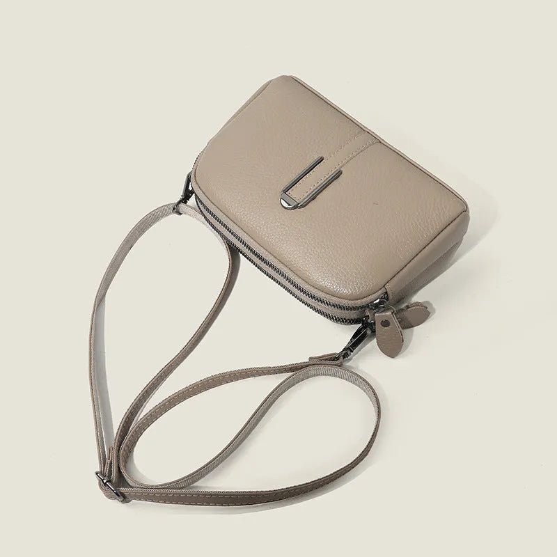 Top-grain leather crossbody bag with splicing design in khaki, horizontal shape, on model