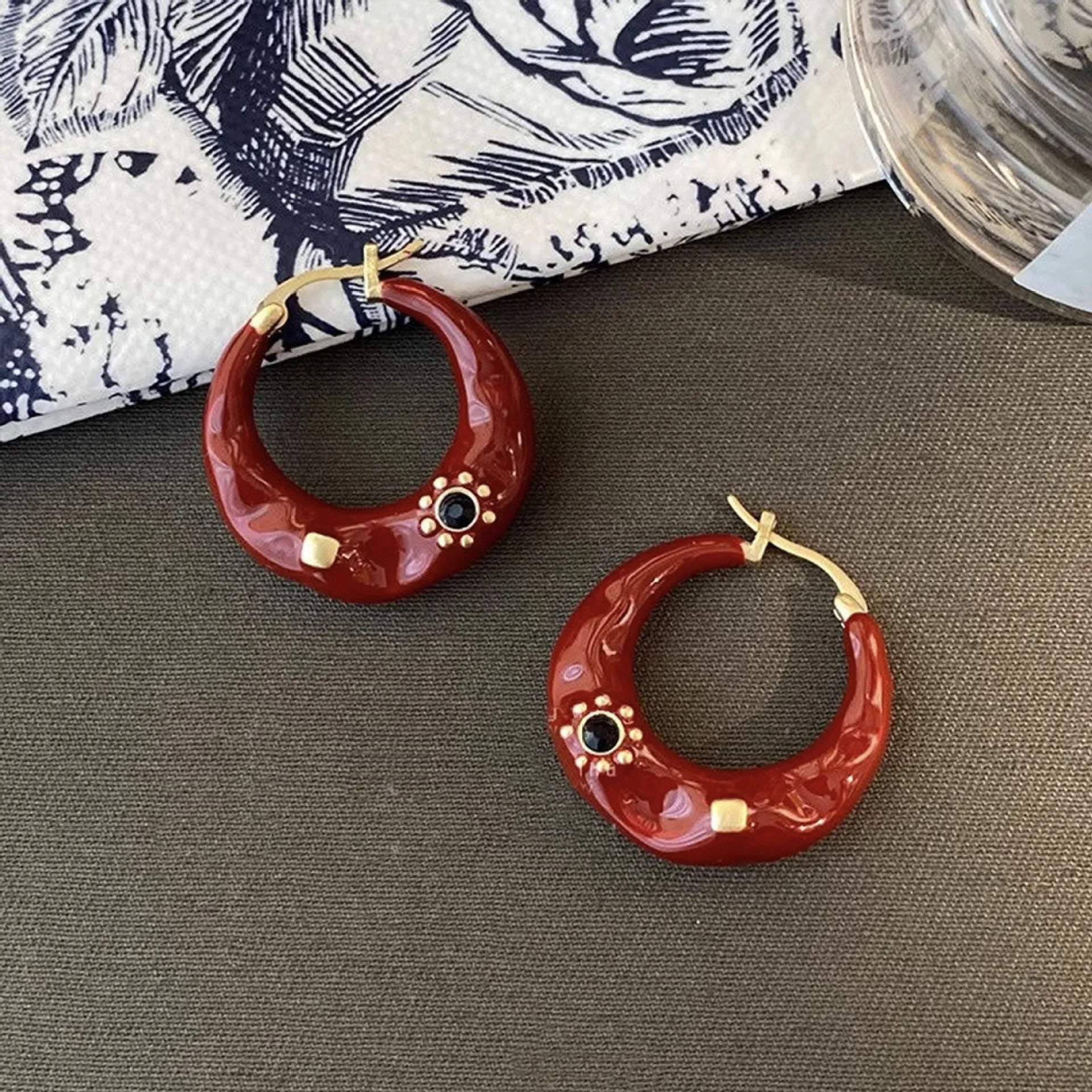 Hong Kong style retro ear studs with rhinestone inlay and dripping oil texture in black and red colours