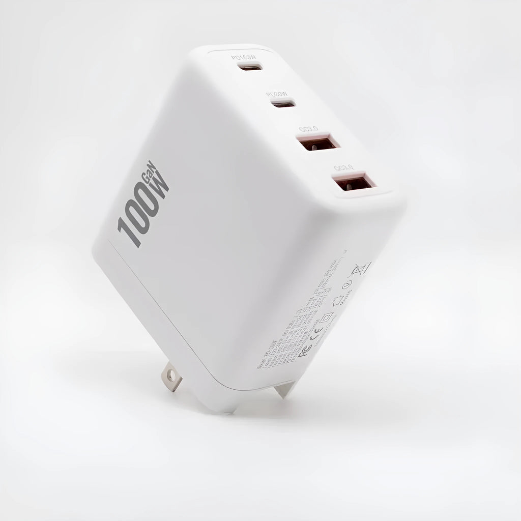White gallium nitride fast charger 100W with Type-C and USB ports, compact size, interchangeable plugs