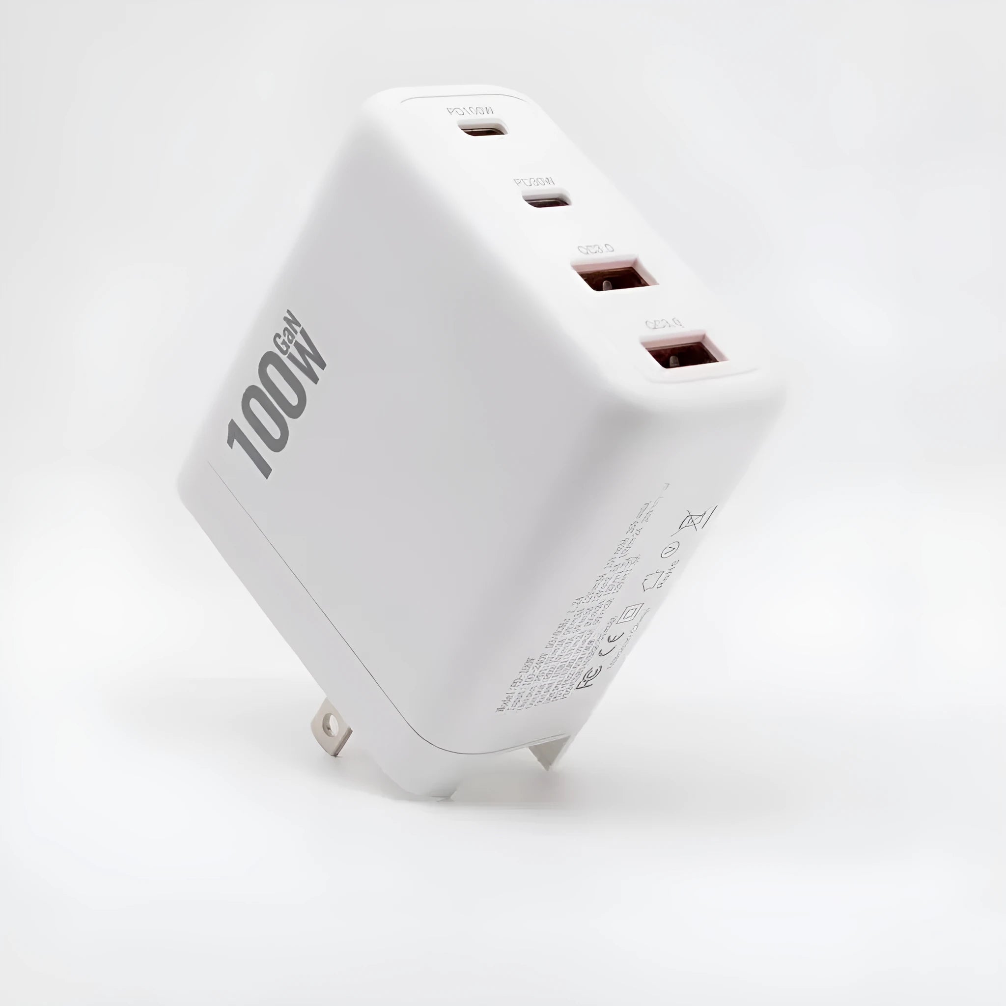 White gallium nitride fast charger 100W with Type-C and USB ports, compact size, interchangeable plugs