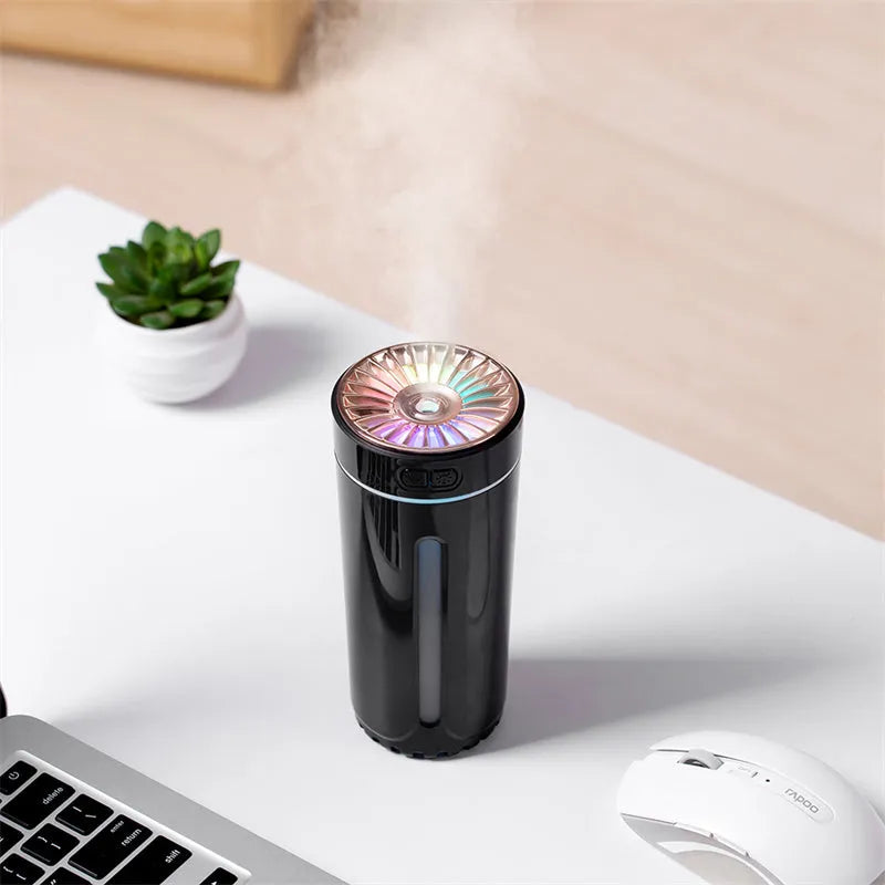 Black portable USB rechargeable humidifier with colourful LED lights on car cup holder
