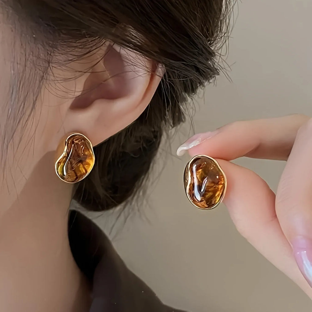 Three pairs of handmade geometric alloy earrings with electroplated finishes and tassel details