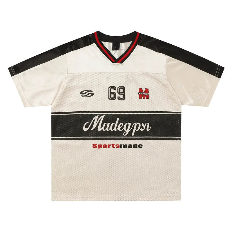 Apricot coloured V-neck sports jersey with short sleeves and letter pattern detail