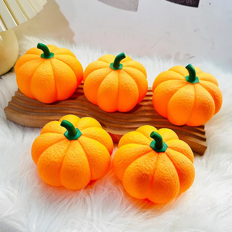 Pumpkin-shaped rechargeable decorative night light on a bedside table, 10.3 x 8 cm