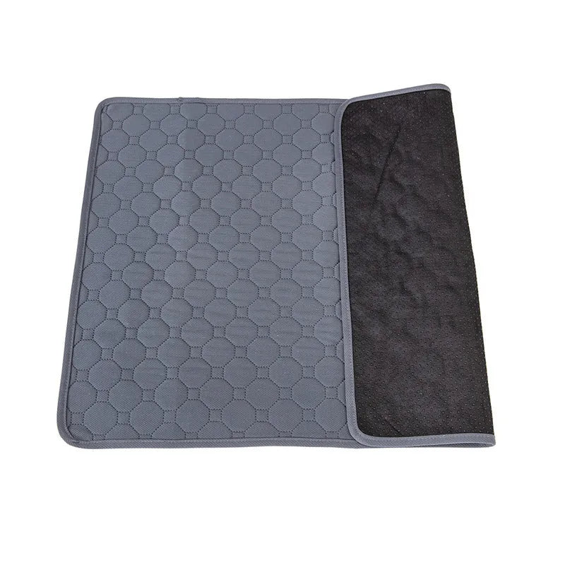 Washable dog pee pads in grey and tan colours showing waterproof backing and triple-stitch edges