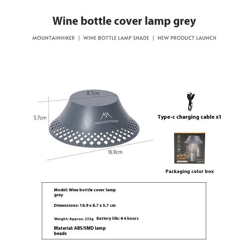 Beige wine bottle camping lantern with USB-C port and gear switch for light modes on wooden table.