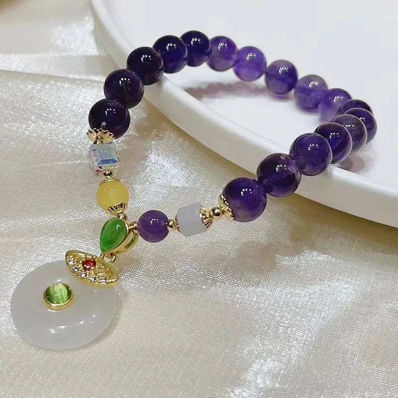 Purple amethyst crystal bracelet with ethnic money bag pendant and peace buckle closure