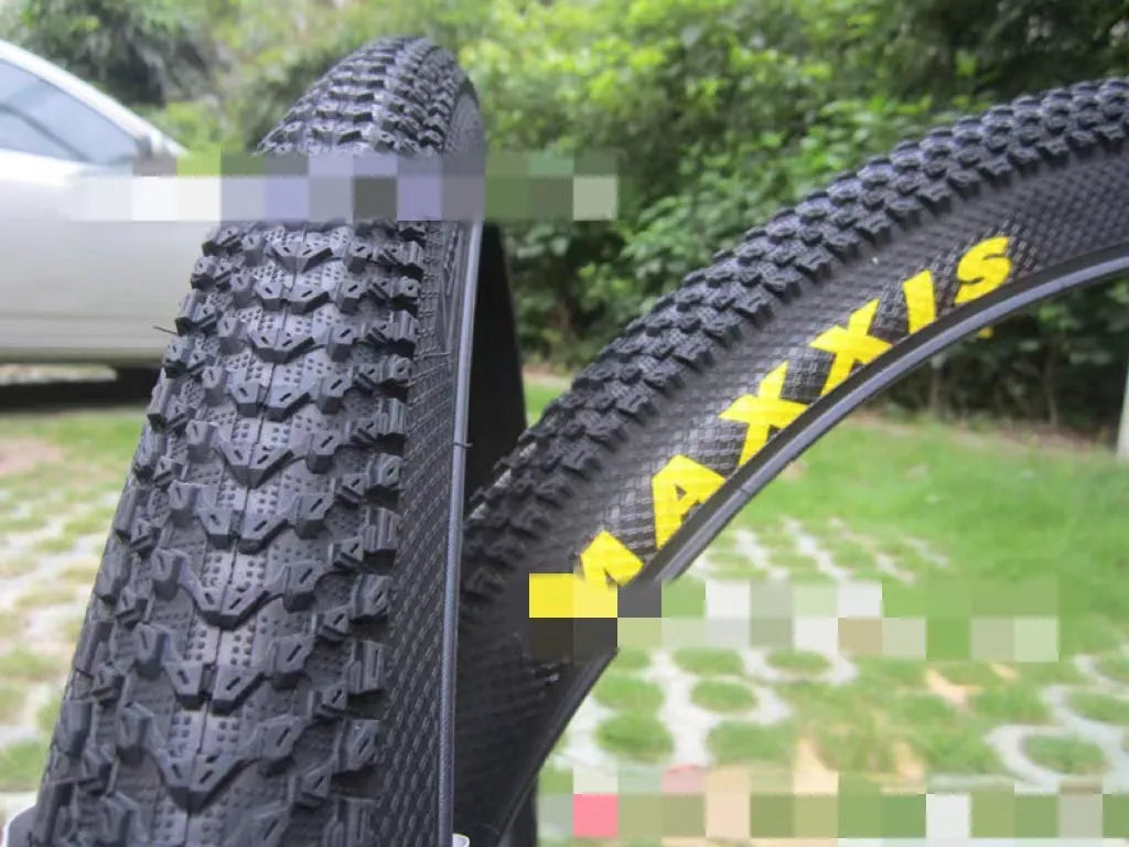 Ultralight black mountain bike tyre with white label option, showing tread pattern and size markings.