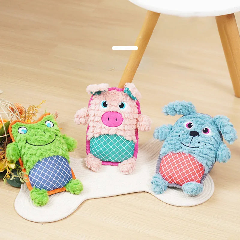 Blue, green, and pink dog toys with sound features and bite-resistant construction safe for molar teeth.