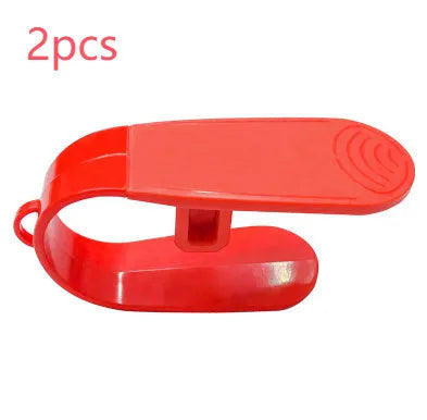 Red ABS coated car seat buckle unlocker measuring 4 x 9 cm on a keyring
