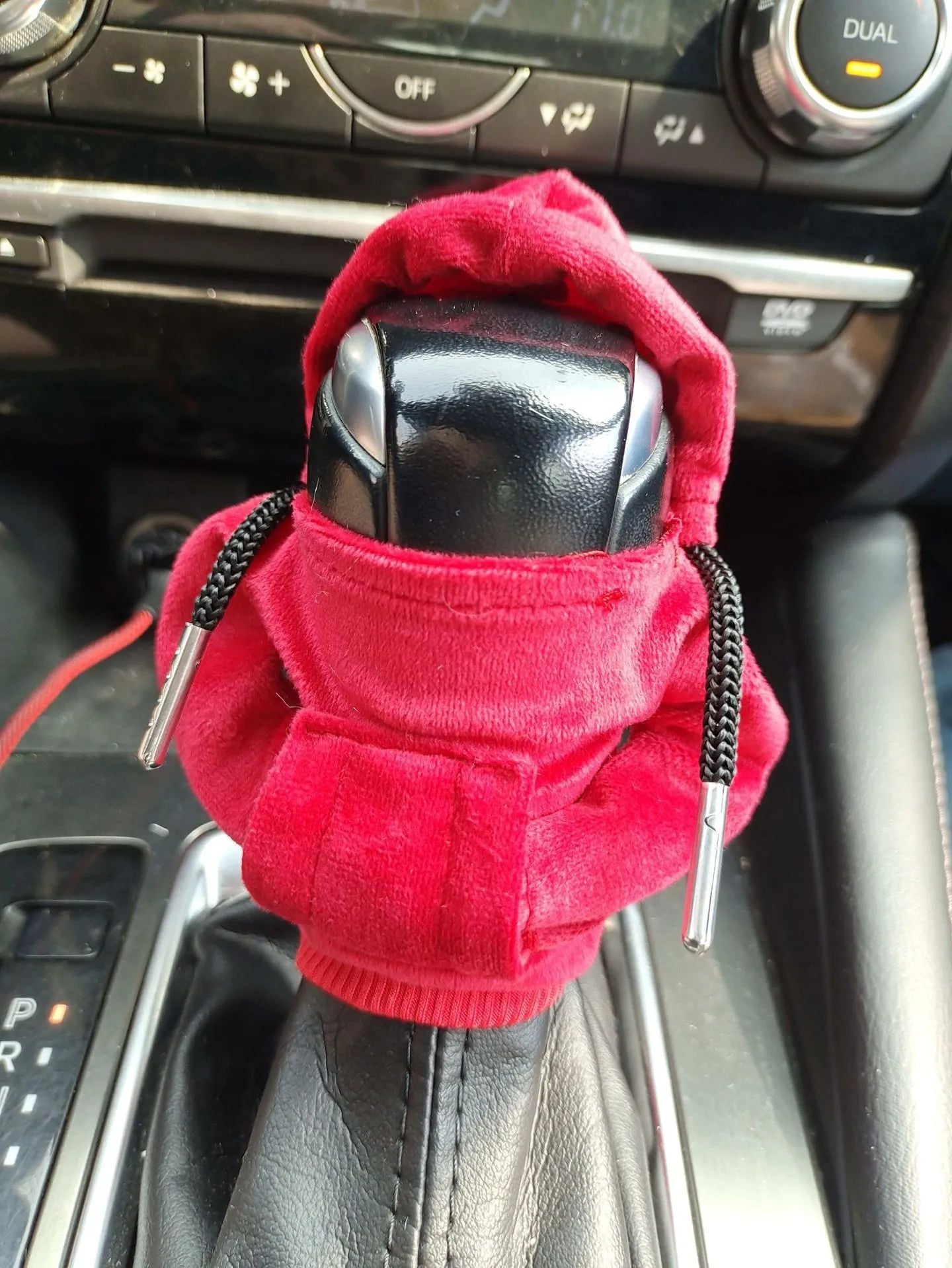 Pure cotton car gear lever decoration in assorted colours on a gear stick.