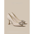 Women's creamy-white pointed-toe stiletto high heels on a plain background.