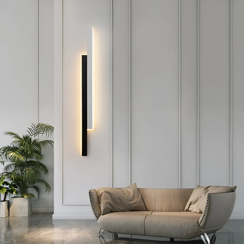 Simple modern wall lamp with a long acrylic shade and grid-free strip light design.