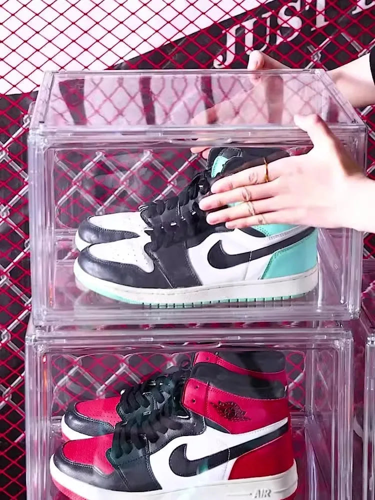 Large transparent acrylic shoe storage box with a magnetic side door open, showing interior space.