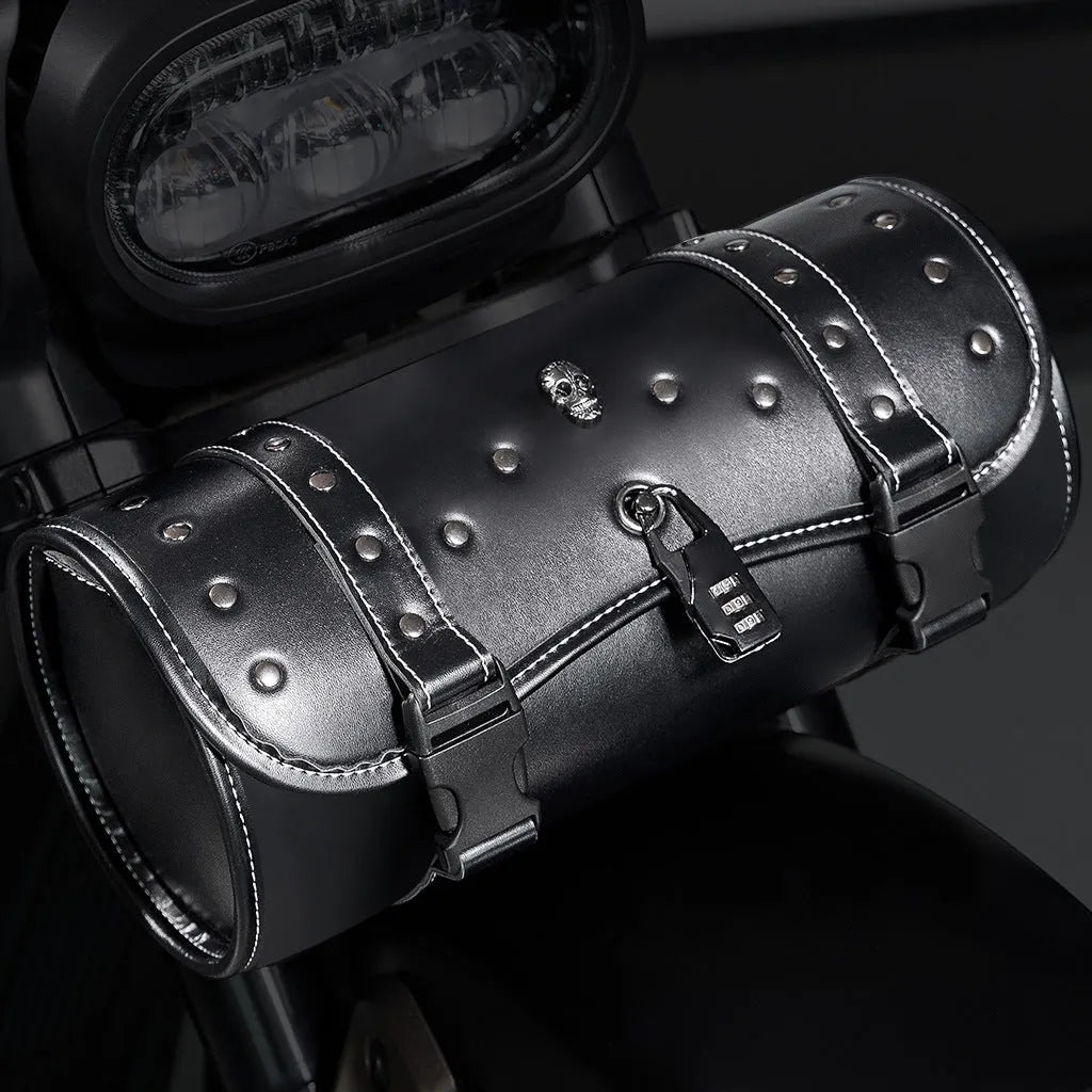 Black PU motorcycle pannier saddlebag mounted on the side of a retro-style bike.