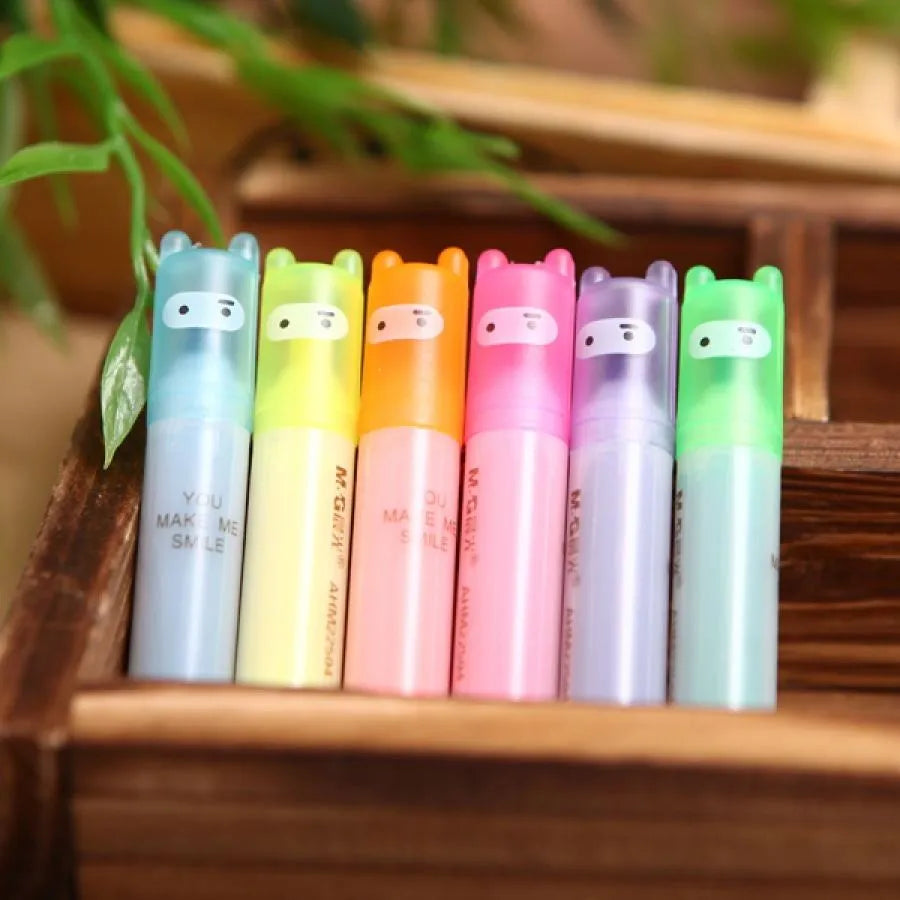 Set of six plastic barrel highlighter pens in yellow, pink, blue, green, orange, and purple colours with oblique tips