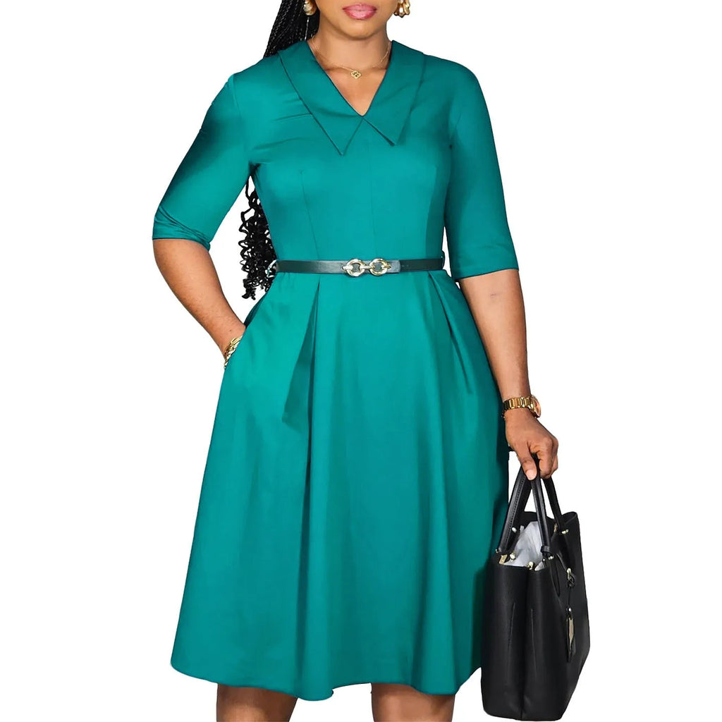 Women's solid colour African dress with half sleeves, high waist, and a matching belt.