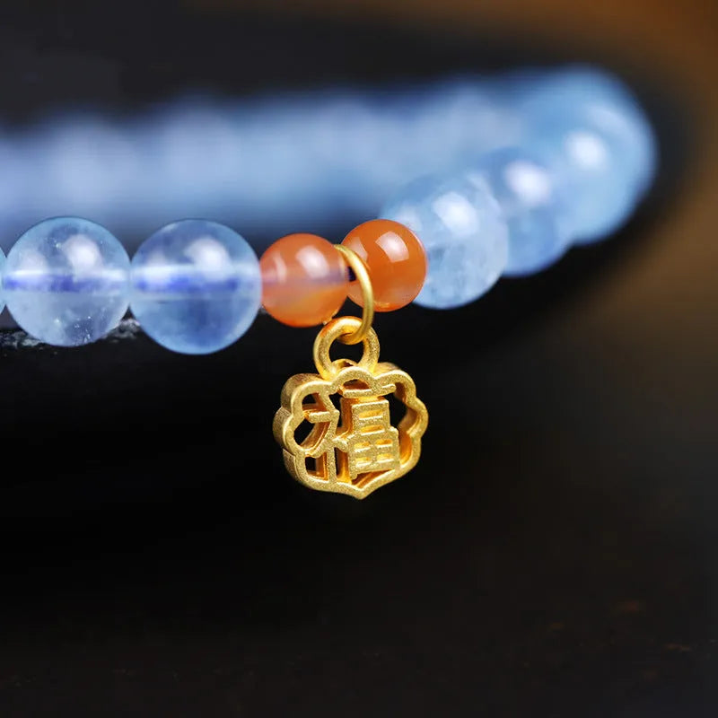 Icy translucent aquamarine crystal bead bracelet with sequin charm and blessing card.