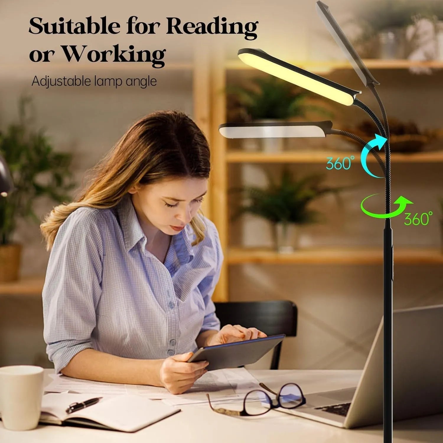 Simple modern LED floor lamp with remote control in white finish on wooden desk for reading