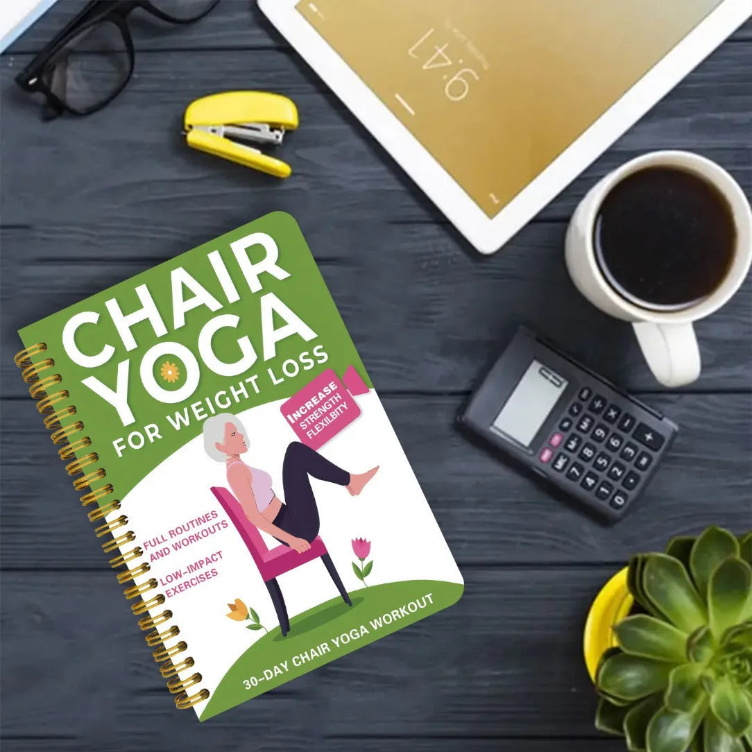 Green coil-bound 30-day chair yoga training notebook open to daily plan page