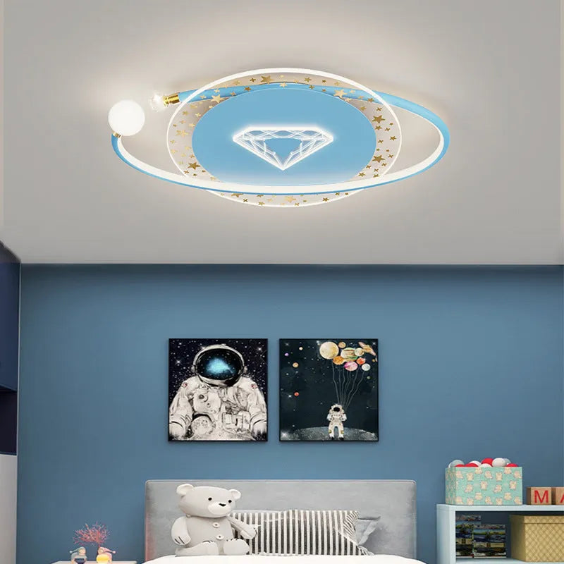 Children's room ceiling lamp with creative moon and cloud design in blue colour on a white ceiling.