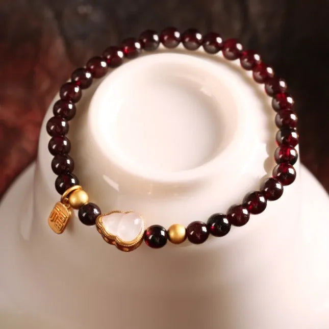 Chinese-style gourd bracelet with imitation garnet beads and Fu character symbols on U-shaped electroplated setting