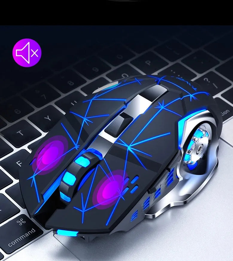 Black and white silent wireless computer mouse on a desk next to a laptop.