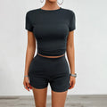 Women's solid colour viscose sports set with round neck T-shirt and elastic shorts on a hanger.