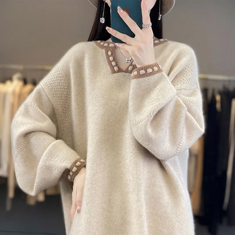 Women's white V-neck long sleeve viscose pullover sweater on a hanger.