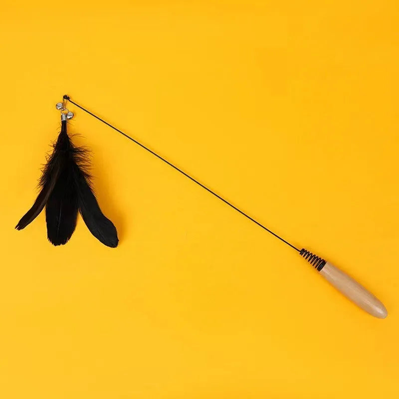Cat teasing stick toy with wooden handle, bell, and feather head in selected colour