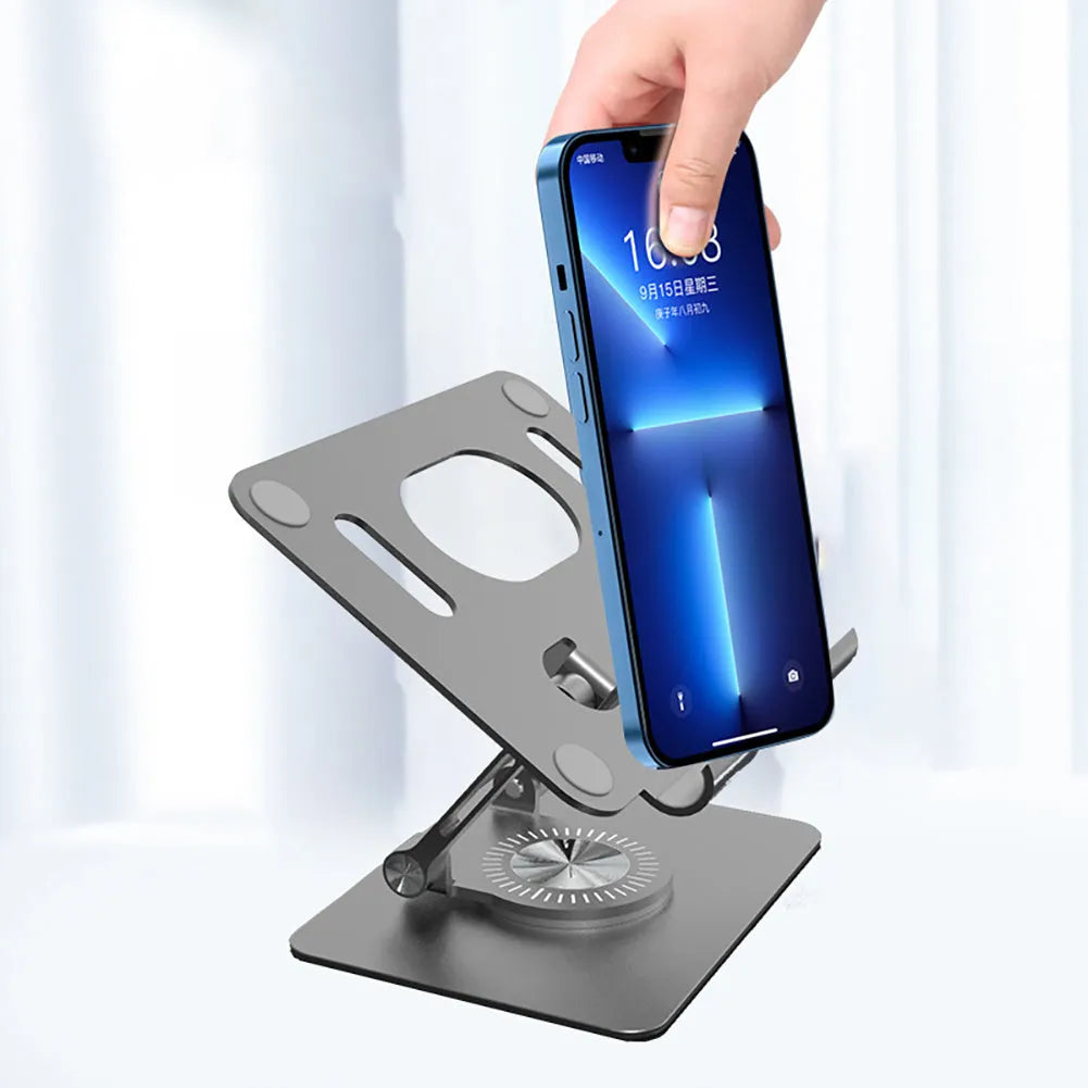 Rotating tablet stand with adjustable height mechanism in technology silver colour showing aluminium plate and silicone grips