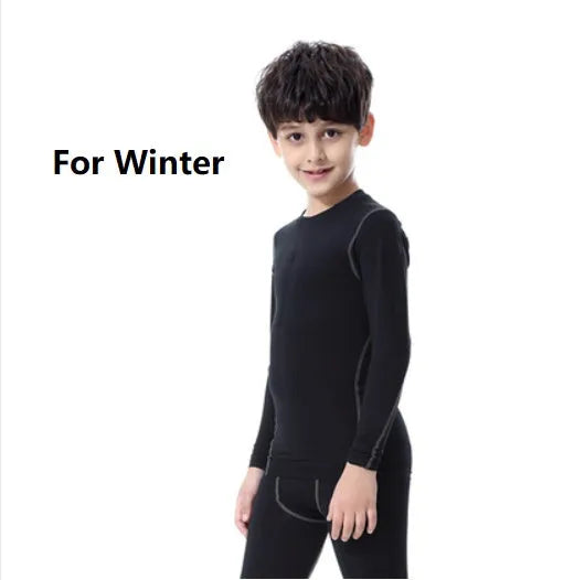 Children's black and green polyester-spandex sportswear set with T-shirt and trousers.