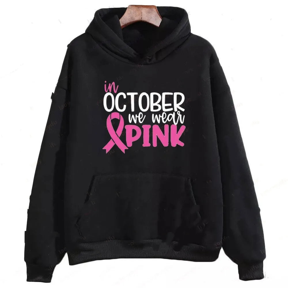 I'm A Survivor retro graphic hoodie in pink colour with side seam pockets, showing long-sleeve pullover design.
