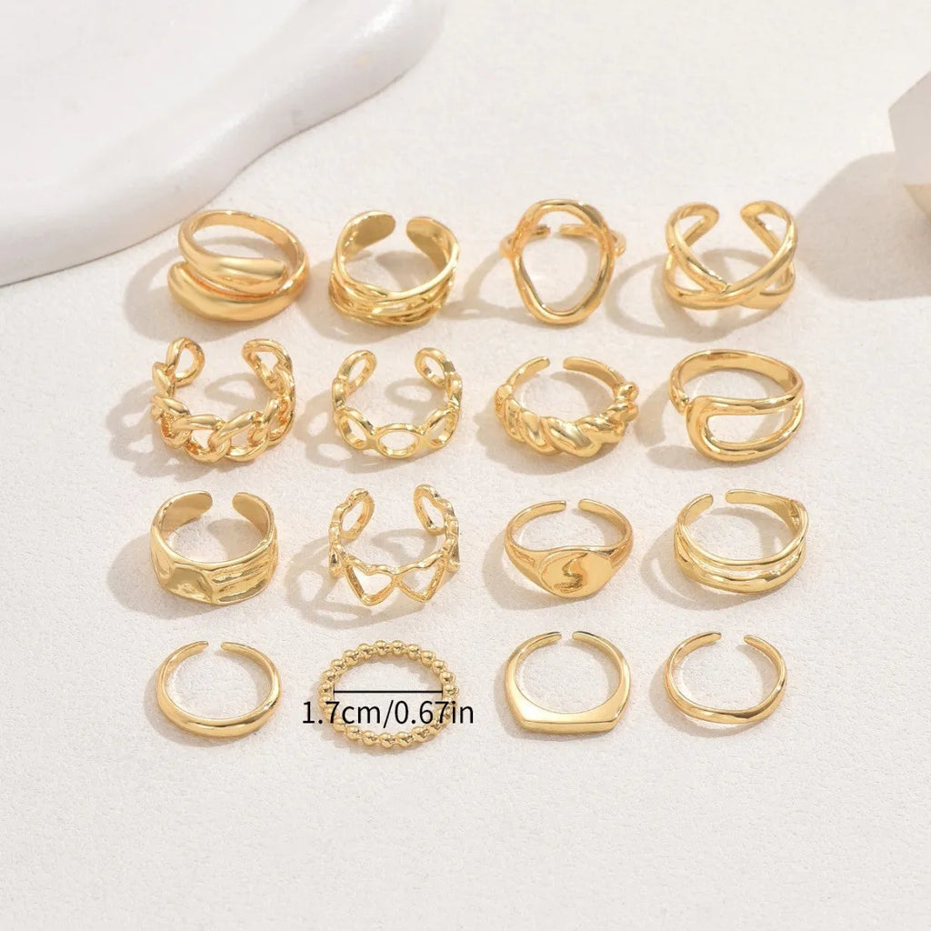 Women's 16-piece open ring suit in silver and gold zinc alloy geometric shape on display