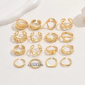 Women's 16-piece open ring suit in silver and gold zinc alloy geometric shape on display
