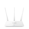 White Asus RT-AX57 Go WiFi 6 router with multiple antennas on a wooden desk