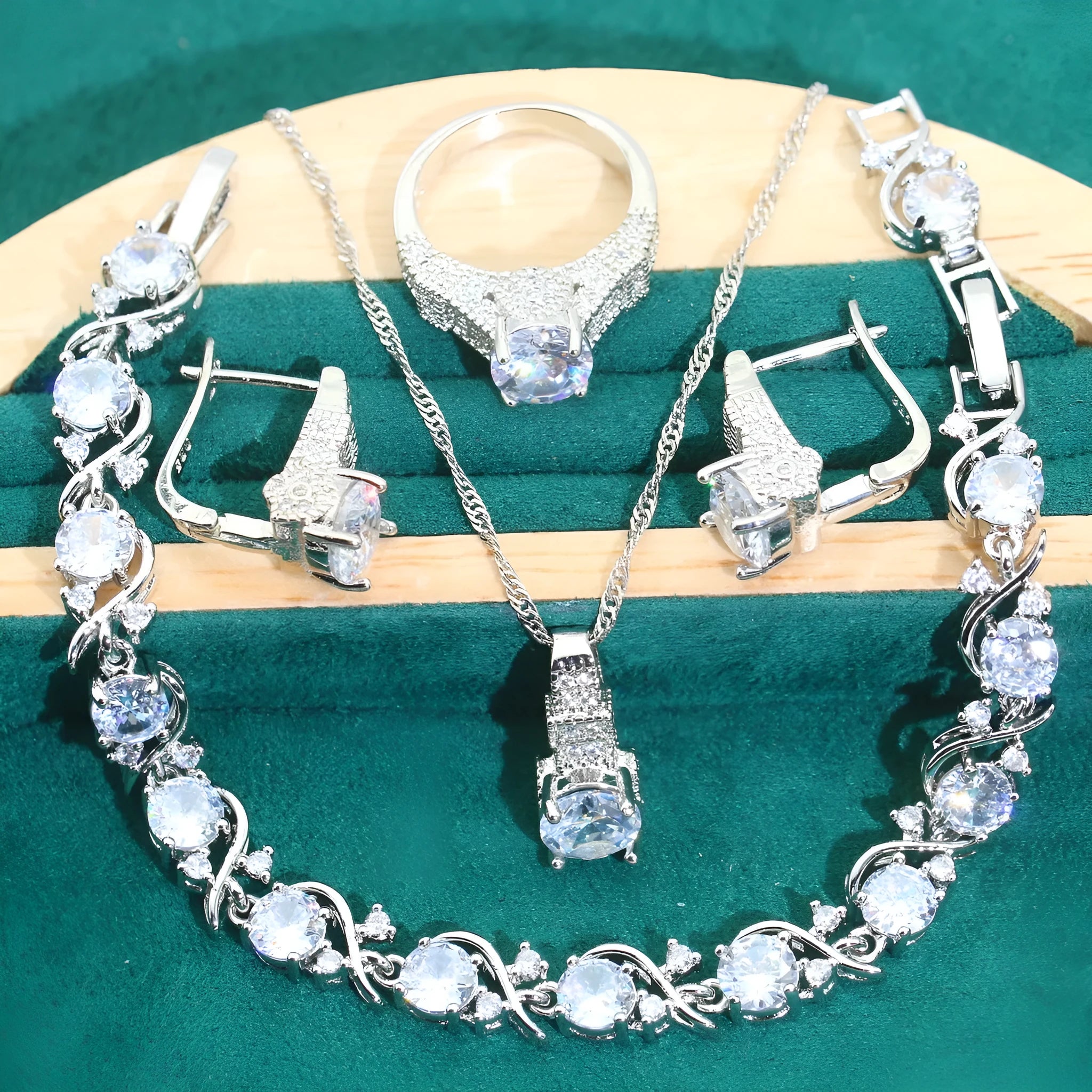 Bridal zircon necklace, bracelet, earrings, and ring four-piece jewellery set in alloy.
