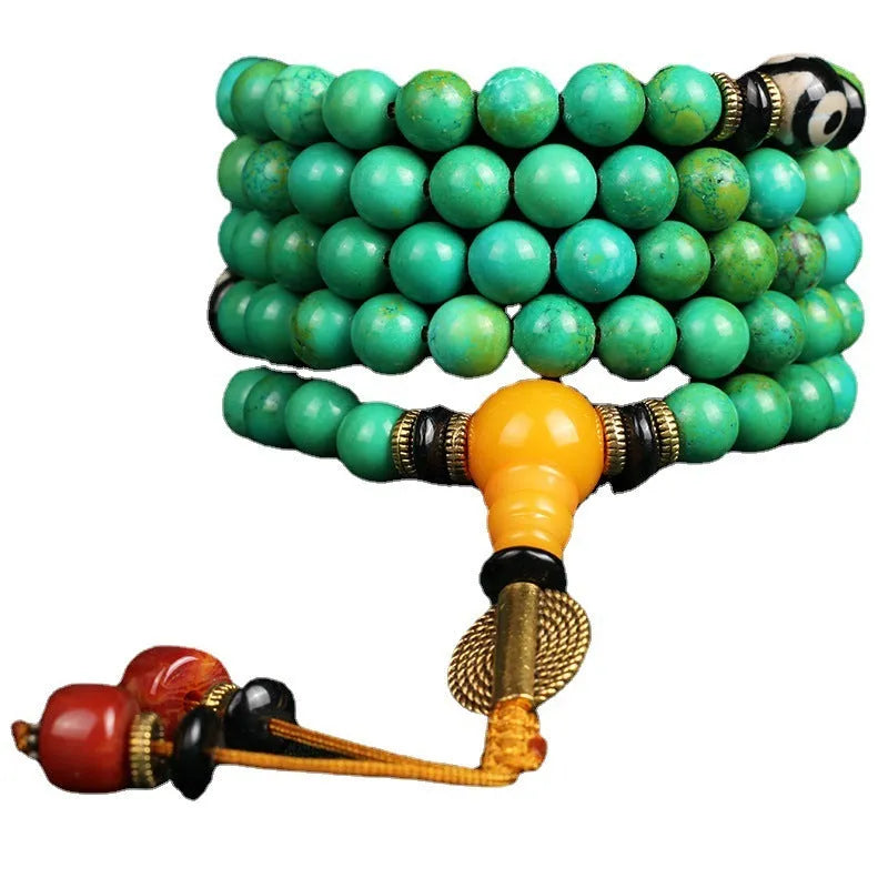 Natural turquoise bracelet with 108 polished 8mm round beads on white background